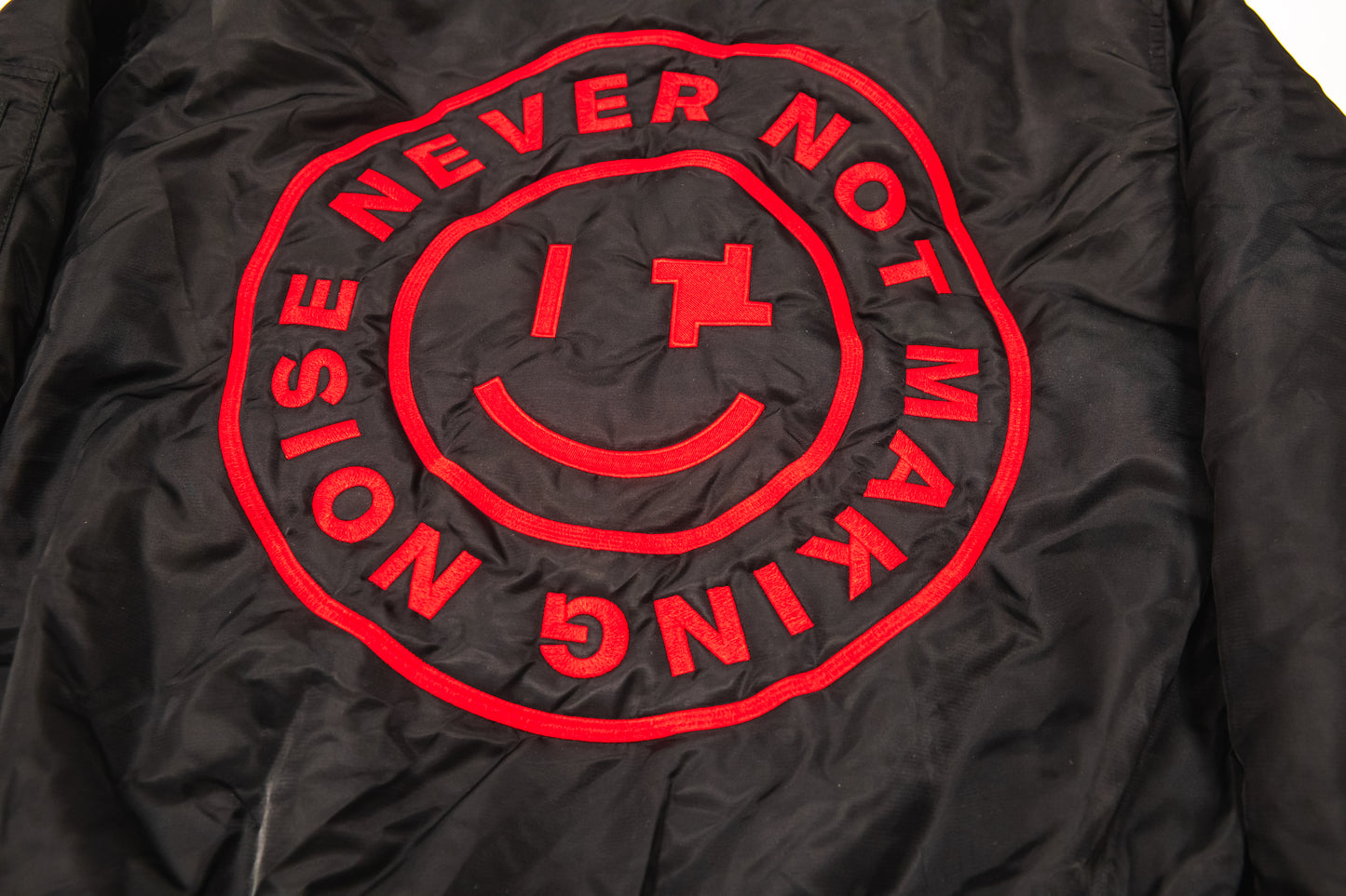 Limited Edition Never Not Making Noise Bomber Jacket in Black/Orange